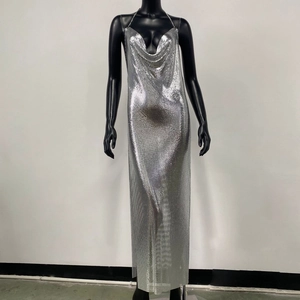 Detail of silver metallic mesh maxi dress featuring deep V-neck and sparkling texture
