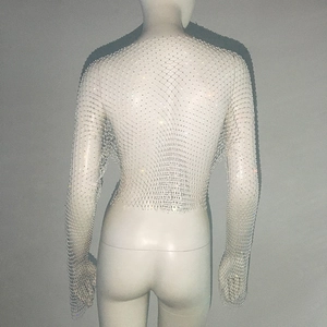 Detail view of the shimmering rhinestone mesh and intricate hollow structure on the back