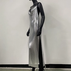 Close-up of silver metal mesh fabric detail on a sexy backless high slit party dress