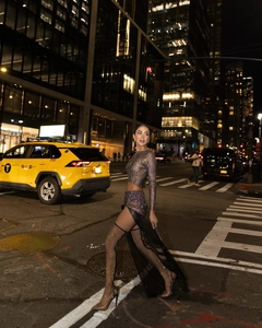 Sparkling rhinestone mesh long sleeve crop top and high slit skirt set in city street