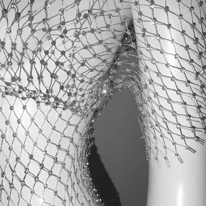 Close-up of diamond rhinestone mesh fabric texture with sparkling crystal details