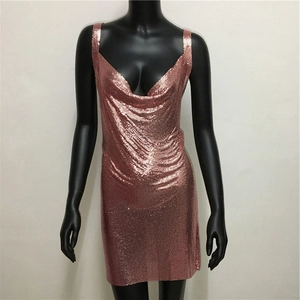 Detailed macro view of the rose gold metallic sequin mesh fabric on this mini dress