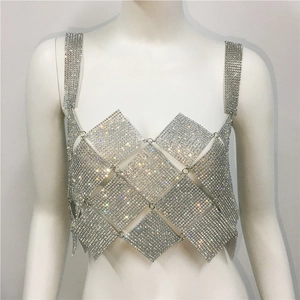Detail of luxury silver rhinestone crop top with diamond shaped metal mesh and sparkling gems