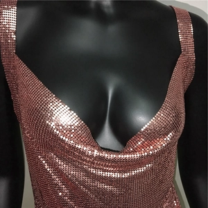 Detail of rose gold metal sequin chainmail top with deep U-neckline and reflective finish