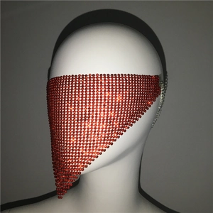 Close-up of sparkling red rhinestone mesh veil mask with hanging metal chain design
