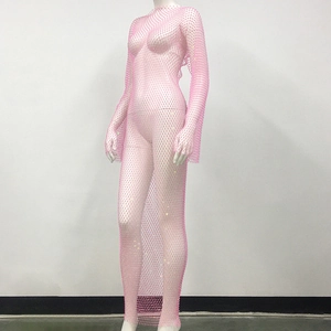 Detail of pink long sleeve fishnet dress featuring sparkling rhinestones and mesh texture