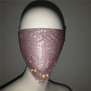 Close-up of pink rhinestone mesh face mask with sparkling triangular fringe for party