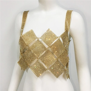 Detail of champagne gold rhinestone body chain vest with diamond-shaped metal sequins