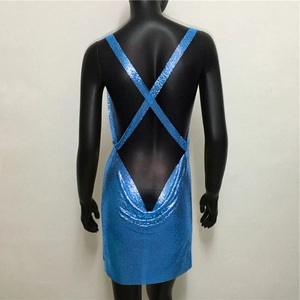 Detail of royal blue sequin dress with cross back straps and sexy open back design