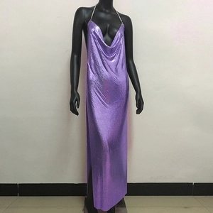 Detailed texture of purple metallic sequin mesh fabric on a sexy deep V-neck dress