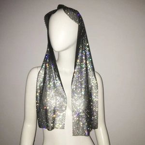 Close-up of sparkling rhinestone fishnet headscarf on a display mannequin