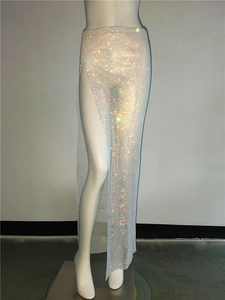 Detailed macro view of sparkling rainbow rhinestones on high-slit mesh skirt fabric