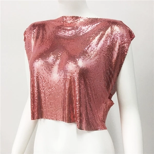 Close-up detail of rose gold metal mesh crop top with shiny sequins and punk style