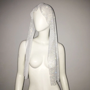 Detail of sparkly rhinestone mesh headpiece featuring silver glitter crystals on net