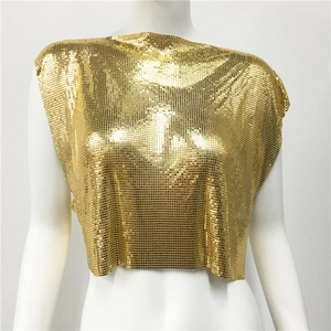Macro shot of gold metallic chainmail top featuring square sequins and woven mesh texture