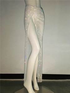 Detailed view of high-slit mesh skirt with multi-colored rhinestones and crystal accents