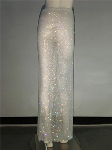 Close-up detail of sheer mesh maxi dress with sparkling silver rhinestones and sequins