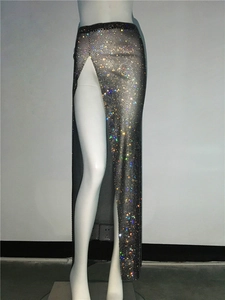 Detail view of black mesh skirt with colorful rhinestones and high side split design