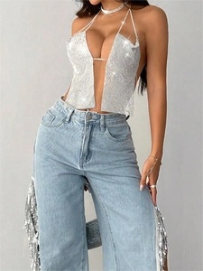 Sexy silver rhinestone halter top with deep V-neck and denim pants with tassel details