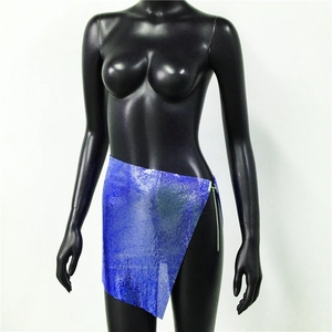 Detail of blue purple sequin skirt with side slit and silver metal chain decoration