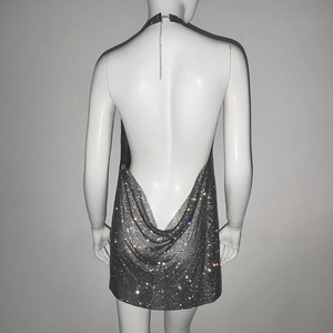 Detail view of the backless design and sparkling sequins on the metallic party dress