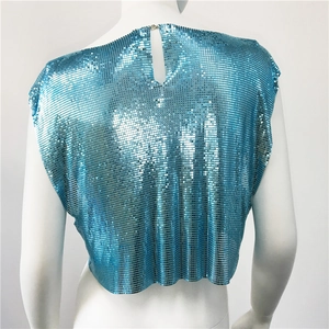 Detail of teal metal sequin cropped top featuring an open back with teardrop cutout