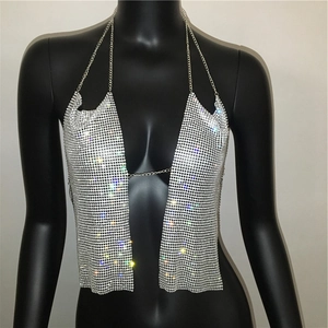 Macro view of sparkly silver rhinestone metal mesh texture with chain link details