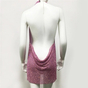 Macro detail of pink rhinestone sequin dress with backless cowl neck and silver chain strap