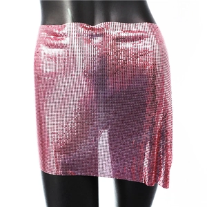 Detailed view of pink sequin mini skirt with shimmering metal discs and mesh texture