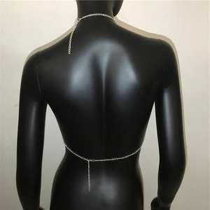 Detail of silver rhinestone body chain with adjustable link on a backless garment model
