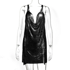 Detail of black metallic mesh sequin dress featuring a draped cowl neck and shiny texture