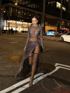 Sparkly rhinestone mesh two-piece set featuring long sleeve crop top and side slit maxi skirt