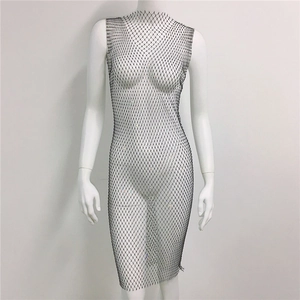 Close-up of silver mesh rhinestone dress featuring sparkling crystals on sheer fabric