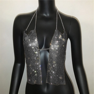 Macro view of silver rhinestone halter top showing sparkling metallic sequin details