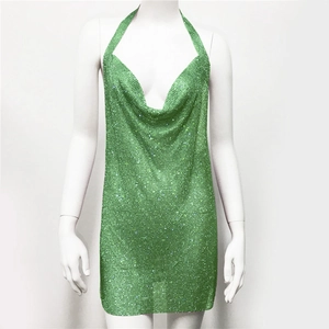 Close-up of green metallic mesh mini dress featuring sparkly rhinestone drape neckline