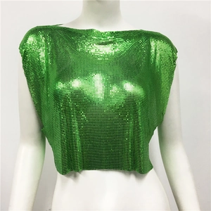 Macro shot of green metallic sequin mesh fabric with reflective party vest details