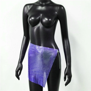 Detailed macro view of purple metallic sequin mesh fabric and silver side chain closure