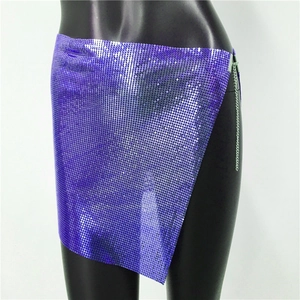 Detailed macro view of purple metallic sequin mesh material and side chain fastener
