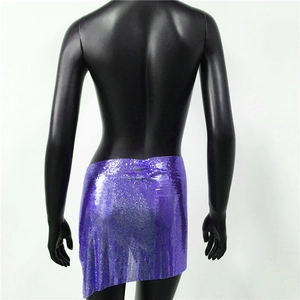 Detail view of purple metallic mesh sequin mini skirt with reflective texture on model
