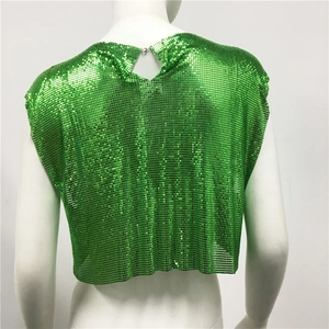 Detail of green metallic sequin crop top featuring chainmail mesh and neck buckle closure