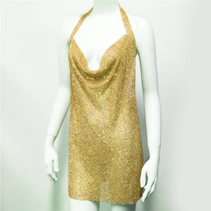 Detail of gold sequin cowl neck mini dress featuring metallic mesh and halter back style