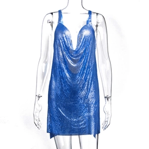Macro shot of blue metallic sequins and mesh texture on a sexy halter neck dress