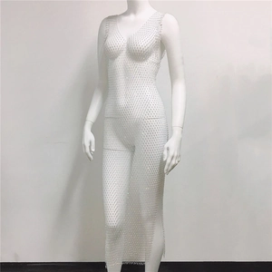 Detail of silver rhinestone mesh dress featuring sparkling diamond cut-outs and mesh texture