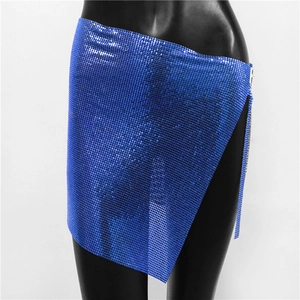 Detail of royal blue metallic mesh mini skirt featuring sequins and asymmetric hem