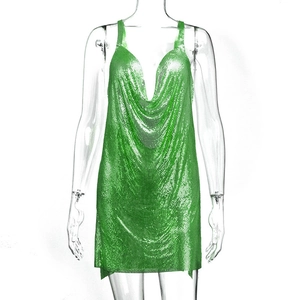 Detailed view of neon green chainmail fabric and cowl neck design on a sequin mini dress