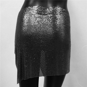 Detail view of dark grey metallic sequin mini skirt with chainmail scale texture