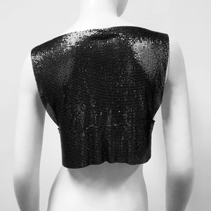 Close-up of black metallic chainmail top featuring intricate interlocking sequins