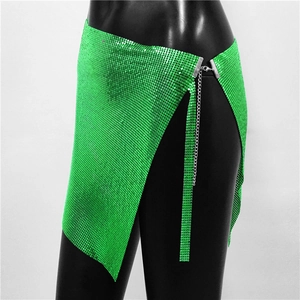 Detail of vibrant green metal sequin mesh mini skirt with silver chain closure