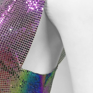 Detailed close-up showing purple and iridescent metal sequins on a cropped party top