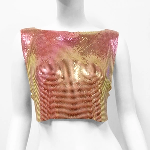 Macro shot of pink and gold gradient metal sequins on a cropped party halter top